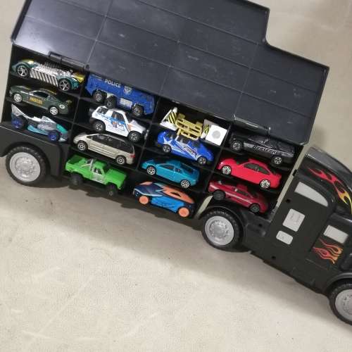 HUGE HOT WHEELS STORAGE TRUCK FILLED ON BOTH SIDES WITH HIGHLY COLLECTIBLE HOT WHEELS CARS