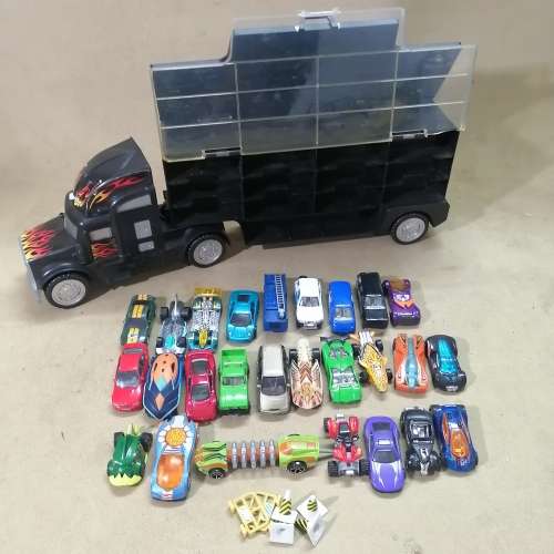 HUGE HOT WHEELS STORAGE TRUCK FILLED ON BOTH SIDES WITH HIGHLY COLLECTIBLE HOT WHEELS CARS