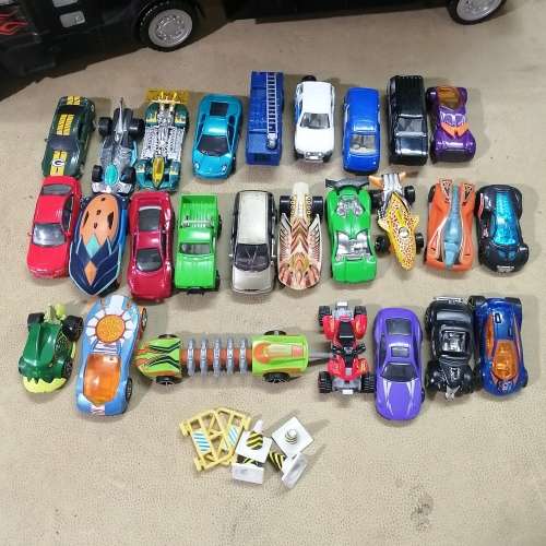 HUGE HOT WHEELS STORAGE TRUCK FILLED ON BOTH SIDES WITH HIGHLY COLLECTIBLE HOT WHEELS CARS