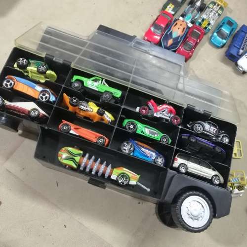 HUGE HOT WHEELS STORAGE TRUCK FILLED ON BOTH SIDES WITH HIGHLY COLLECTIBLE HOT WHEELS CARS