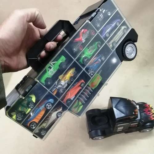 HUGE HOT WHEELS STORAGE TRUCK FILLED ON BOTH SIDES WITH HIGHLY COLLECTIBLE HOT WHEELS CARS