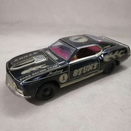 VINTAGE TIN TOY FORD MUSTANG STUNT CAR, MADE IN JAPAN, BATT. POWERED RUNS GOOD!!