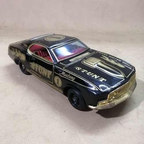 VINTAGE TIN TOY FORD MUSTANG STUNT CAR, MADE IN JAPAN, BATT. POWERED RUNS GOOD!!