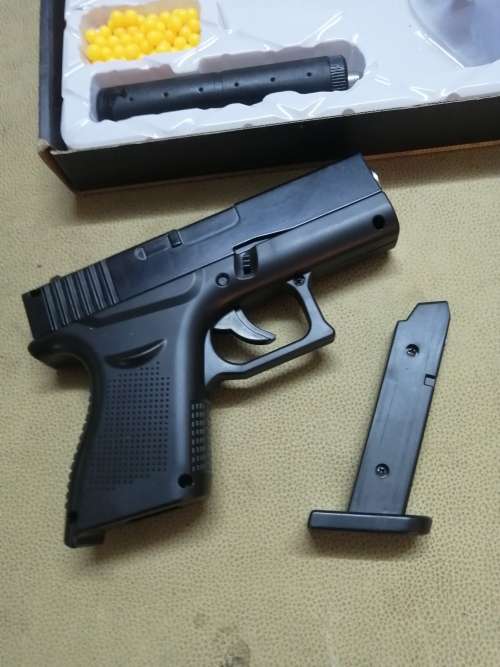 GLOCK 43 WITH SILENCER - ZINC ALLOY SHELL AIRSOFT GUN COMPLETE IN BOX