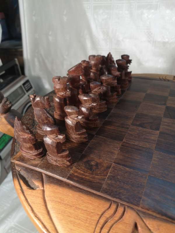 Hand Carved Tribal Chess Set on a Double sided Tri-Leg Coffee Table
