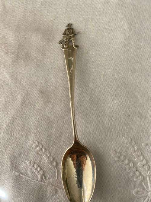 SIVER SPOON WITH GUNNER AT TOP HAS MARKINGS