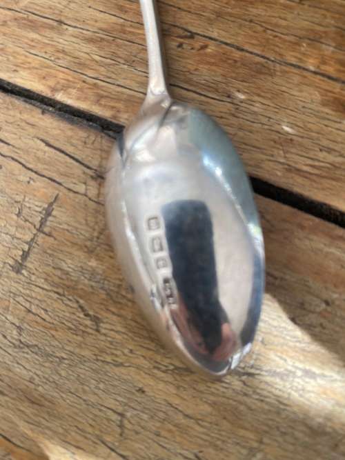 SIVER SPOON WITH GUNNER AT TOP HAS MARKINGS