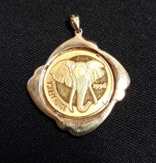 Gold Pendant with 1996 1/4 OZ Gold 999.9 NATURA Elephant Set In a 9ct Setting with 12 small Diamonds