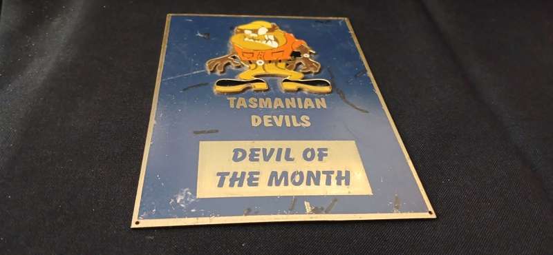 TASMANIAN DEVILS   `` DEVIL OF THE MONTH `  BRASS AND ENAMEL PLAQUE WITH RAISED EMBLEM        No,7