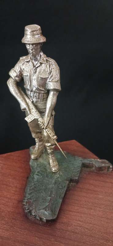 SA BORDER WAR  TROOPIE STATUETTE ON A WOODEN BASE  -- SWA NAMIBIA        ( Weight: 250 grams )