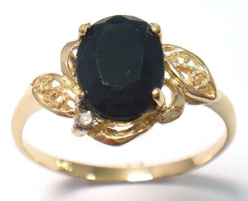 10KT SOLID YELLOW GOLD RING WITH BLACK SAPPHIRE AND DIAMONDS.