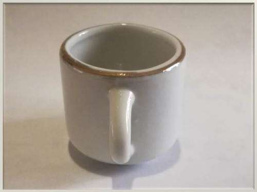 Miniature porcelain cup with gilt finishing