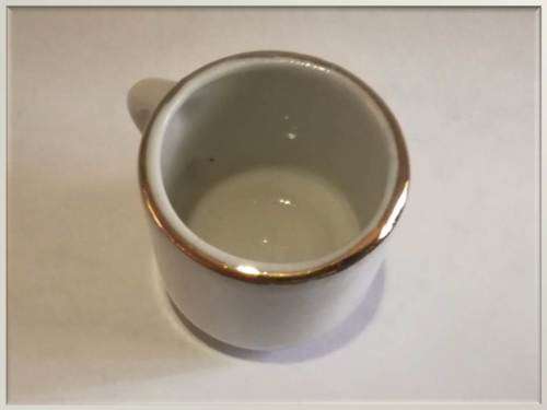 Miniature porcelain cup with gilt finishing