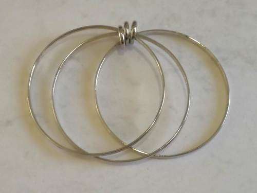 3 Interlocked silver-plated bangles