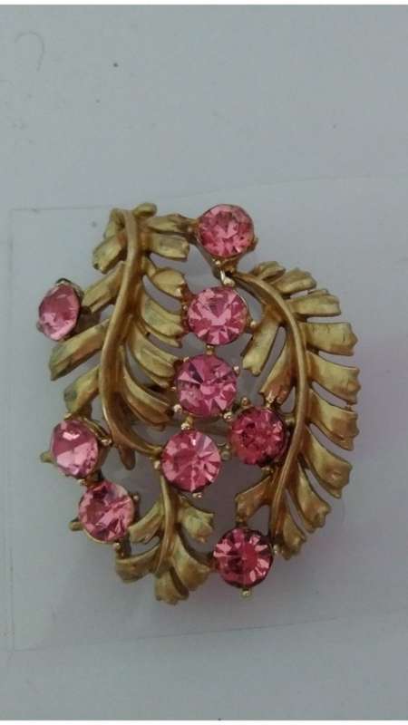 Gold tone and pink stone  brooch