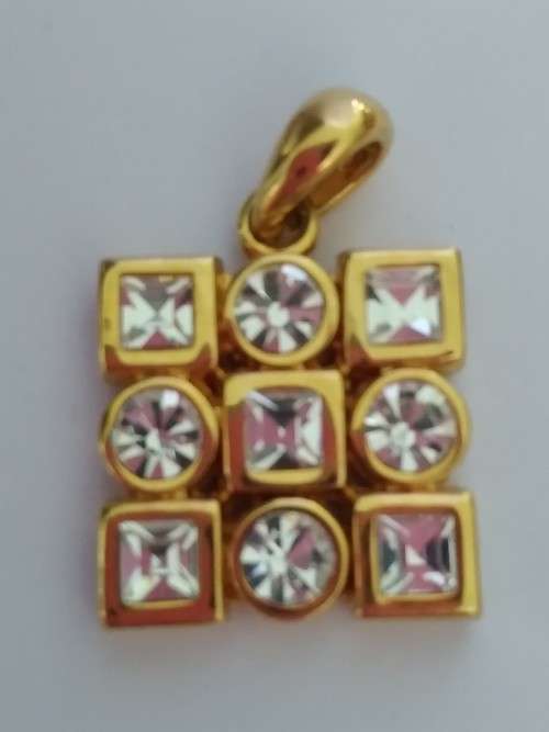 Gold tone pendant