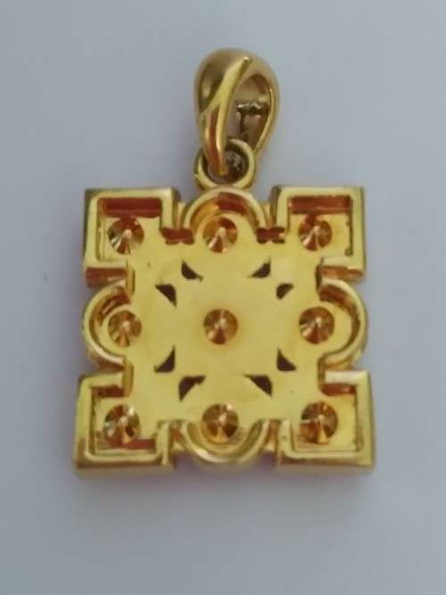 Gold tone pendant