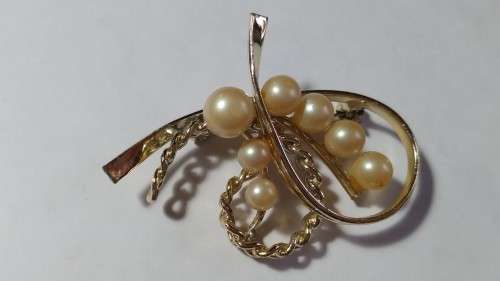 Faux pearl and gold tone swirl brooch