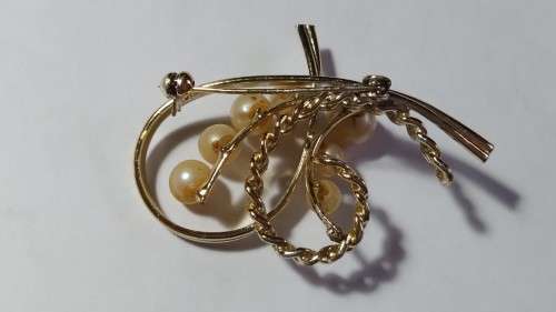 Faux pearl and gold tone swirl brooch