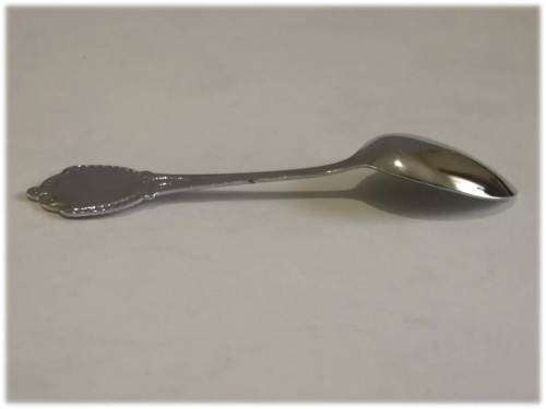 Miniature silver tone plastic spoon