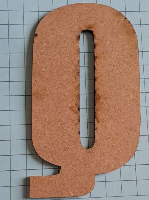 Wooden orange `Q`