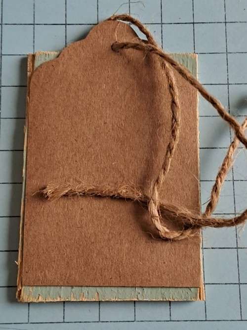 Wooden Christmas tag/decoration with message +/- 12cm - brown rope