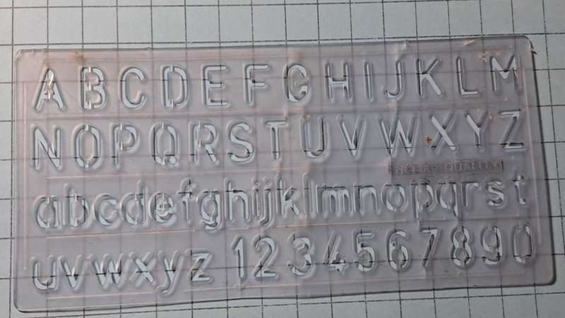 Alpha-numerical stencil - +/- 15.5cm x 6.5cm