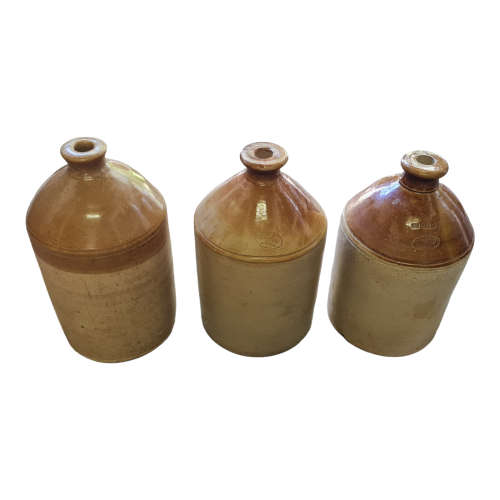 Three vintage one gallon stoneware `Vereeniging` ginger beer jars.