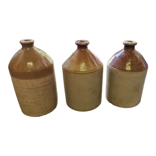 Three vintage one gallon stoneware `Vereeniging` ginger beer jars.