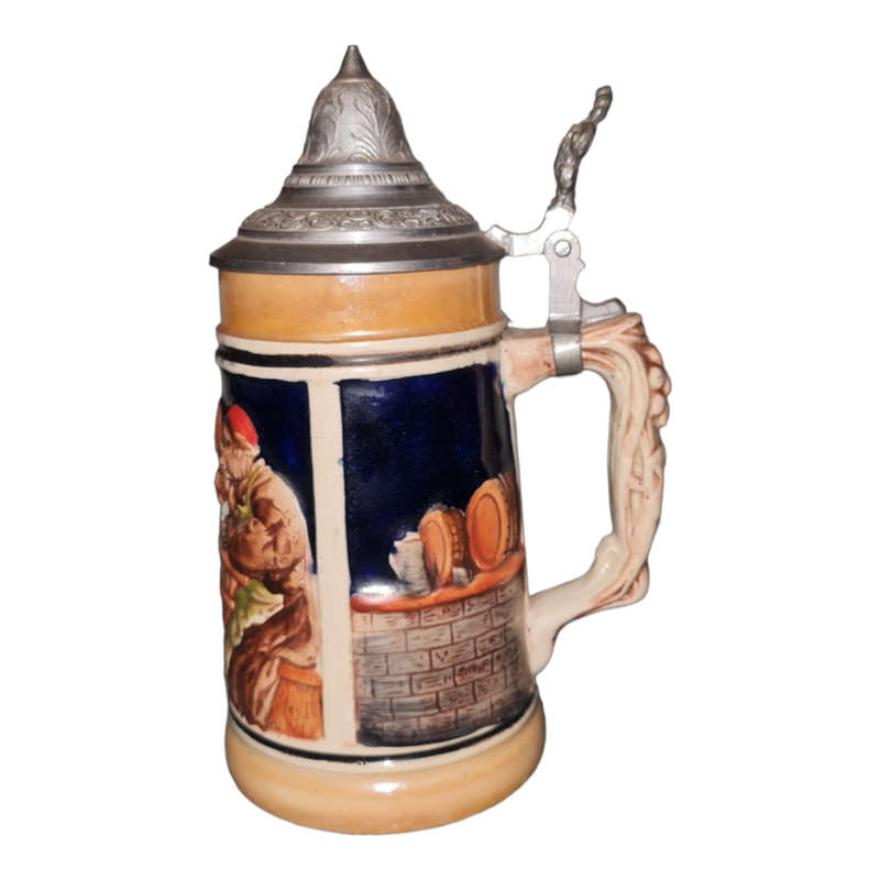 Vintage German ceramic beer mug with a hinged pewter lid.