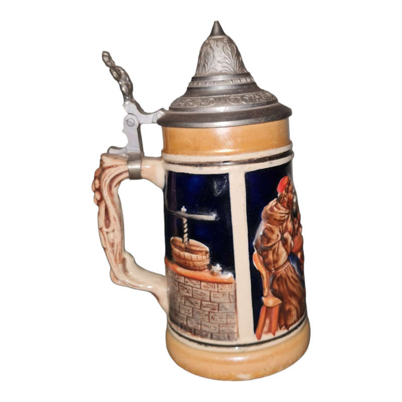 Vintage German ceramic beer mug with a hinged pewter lid.