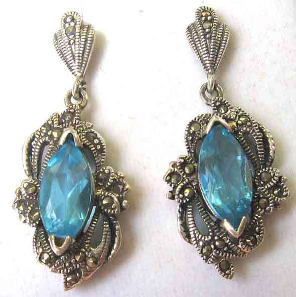 A pair of Sterling Silver , Marcasite and Blue Topaz Earrings.