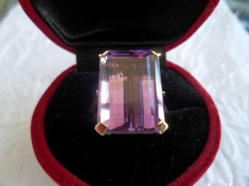 Spectacular 15ct emerald cut amythest set in 9ct gold.