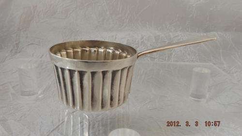 Silver Measuring Cup.