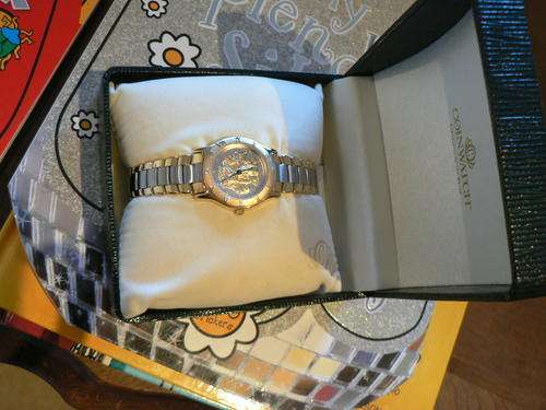 WOMANS " BIG FIVE" GOLD AND SILVER WATCH