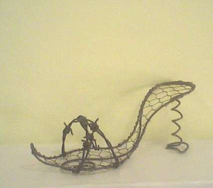 Cheeky high heel shoe with barbwire detail.