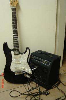 ELECTRIC GUITAR AND JOHNSON AMPLIFIER