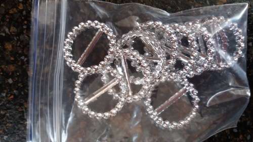 25mm diamante look-alike plastic buckles. 10 per packet. One bid per packet of 10