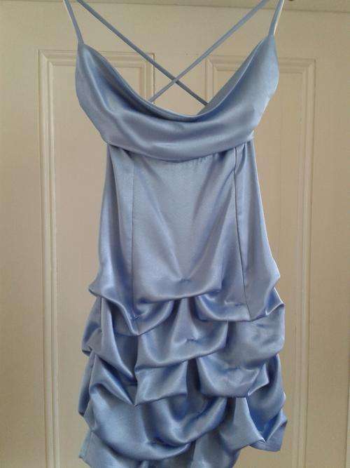 sky blue pick up dress with spagetti straps and low back.  Size 32