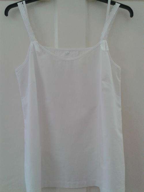 White cotton Collins camisolewith lace shoulder detail. Size 32