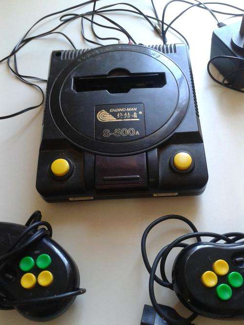 Retro 1980's  video games console and 6 cassettes with lots of different games