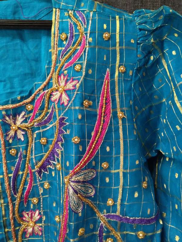 Blue and gold sari top and flare skirt