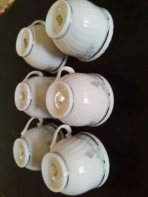 6 Floral porcelain tea cups with silver trim New