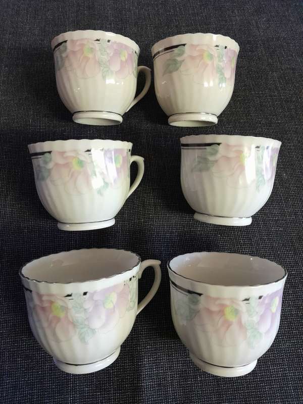 6 Floral porcelain tea cups with silver trim New