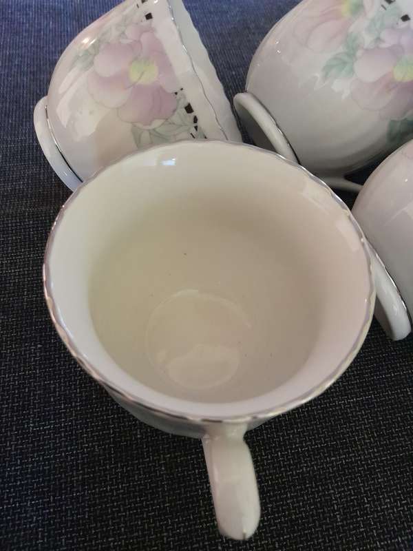 6 Floral porcelain tea cups with silver trim New