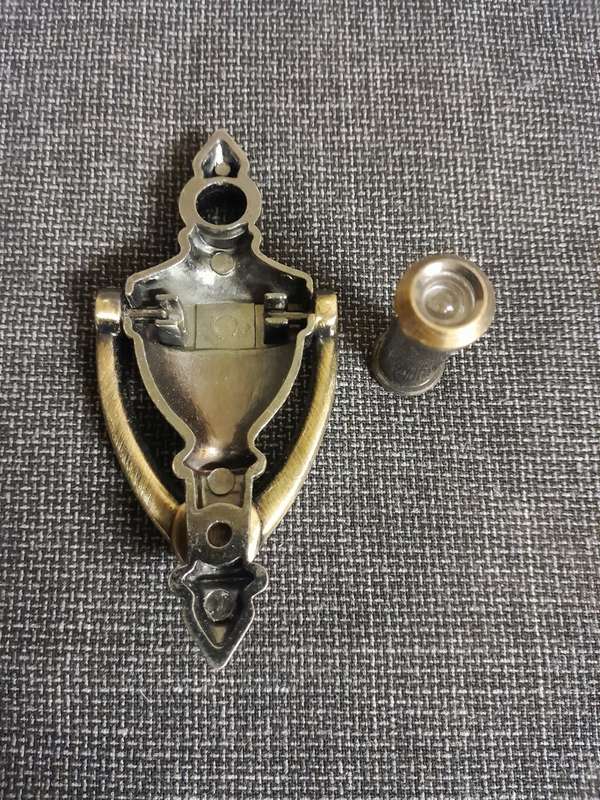 Vintage door knocker with peephole door viewer