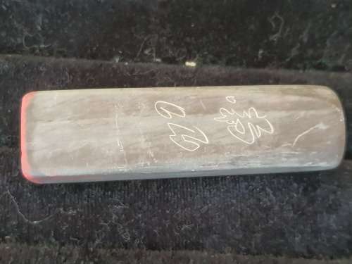 AN ANTIQUE CHINESE OR JAPANESE PERSON STAMP