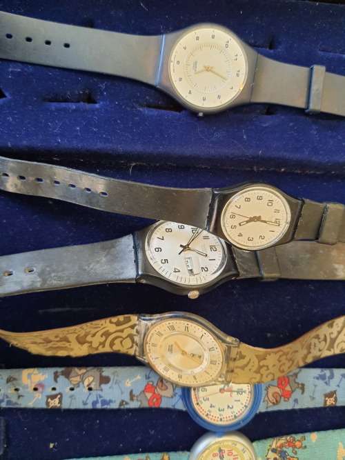 A JOBLOT OF 13 WOMANS OR GIRLS SWATCH WATCHES ALL NEED NEW BATTERIES