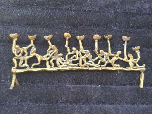 A VINTAGE MENORAH BRASS MADE IN JERUSALEM APPROXIMATELY 520 GRAMS