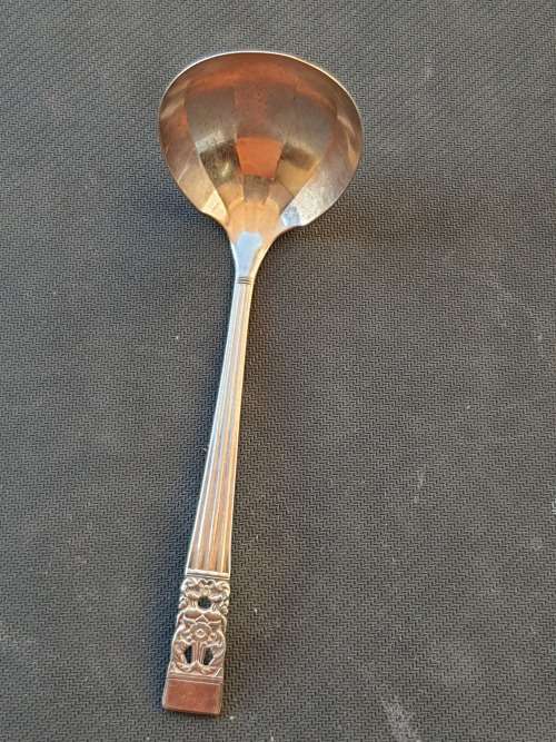 A SILVER PLATED SOUP LADEL IN PERFACT CONDITION STAMPED COMMUNITY